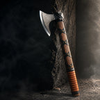 Hatchet leaning against dark stone wall, dramatic lighting on textured leather handle